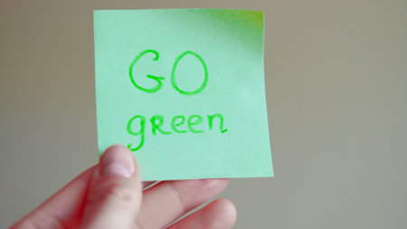 Sticky note reminders on kitchen refrigerator promoting healthy eating and wellness.の写真素材