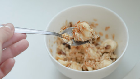 Simple and nutritious breakfast with oats, banana and cinnamon.の写真素材