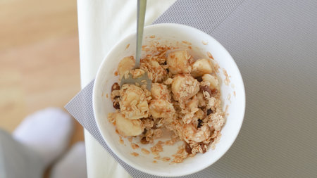 Clean eating breakfast with banana and cinnamon topped oatmeal bowl.