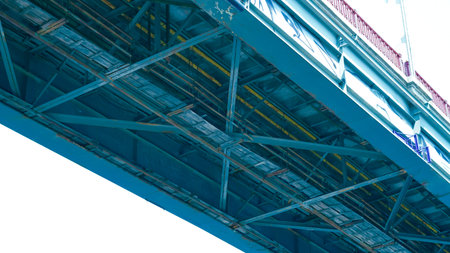 Low angle profile of pedestrian bridge showing minimalist steel frame architecture.の写真素材