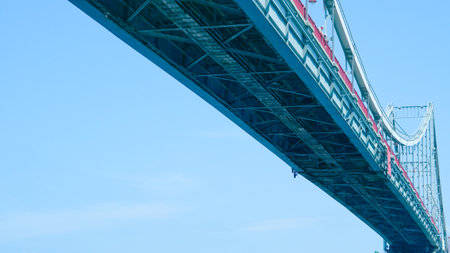 Minimalist footbridge underside captured from below with strong modern design,blue tonesの写真素材