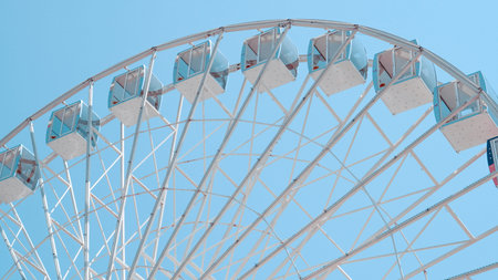 Ferris wheel structure against blue sky in leisure park concept photo.の写真素材