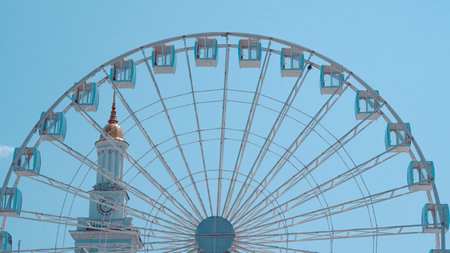 Ferris wheel against sky captures park leisure and entertainment conceptの写真素材
