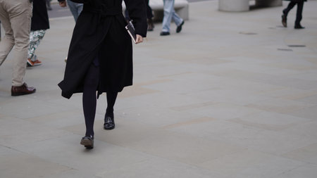People walking casually, everyday life in the city.の写真素材