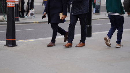 People walking down the street, city bustle, everyday motion.の写真素材