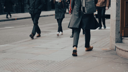People walking down the street, city bustle, everyday motion.の写真素材