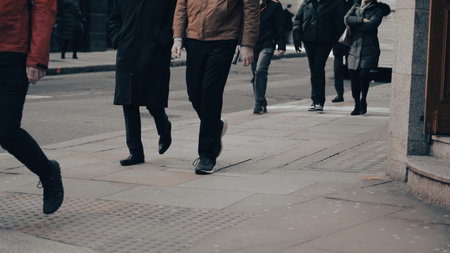 People walking down the street, city bustle, everyday motion.の写真素材