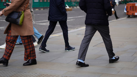 People walking down the street, city bustle, everyday motion.の写真素材