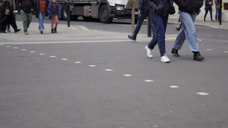 Weekday city life with people walking along urban streets.の写真素材