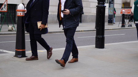 People walking casually, everyday life in the city.の写真素材