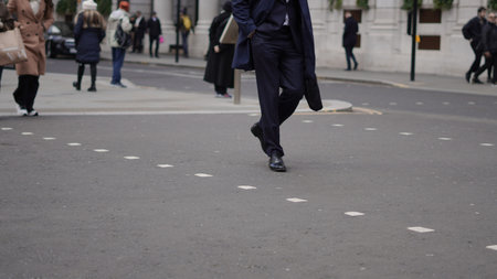 Weekday city life with people walking along urban streets.の写真素材