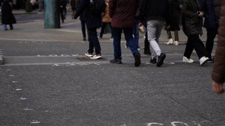 Weekday city life with people walking along urban streets.の写真素材
