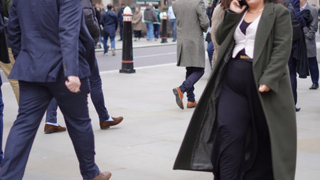 People walking casually, everyday life in the city.の写真素材