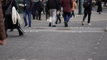 Weekday city life with people walking along urban streets.の写真素材