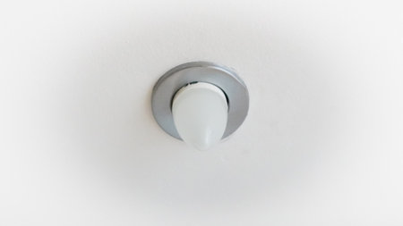 Decorative ceiling lights in public indoor space with clean symmetry.の写真素材