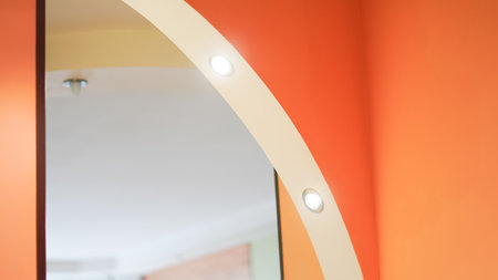 Minimal ceiling lights in modern interior with white walls and soft glow.の写真素材