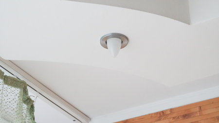 Decorative ceiling lights in public indoor space with clean symmetry.の写真素材