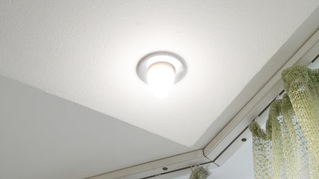 Artistic modern ceiling light concept with geometric shapes and glow.の写真素材