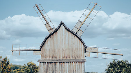 Rustic windmill close up showcasing vintage farming mechanism in motion.の写真素材