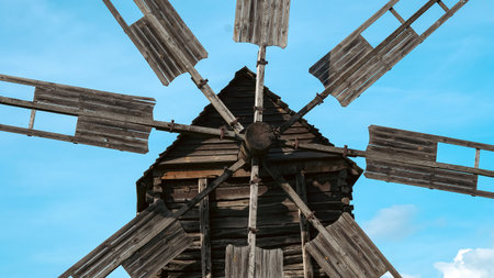 Historic windmill close view showing gear, wood and mechanical details.の写真素材