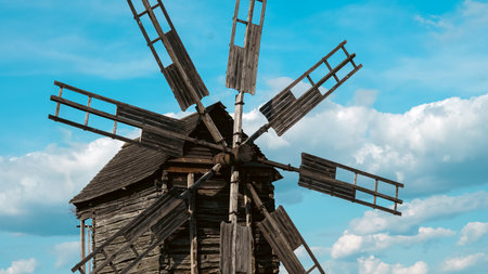 Historic windmill close view showing gear, wood and mechanical details.の写真素材