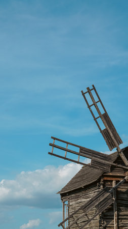 Closeup of wooden windmill showing old farming technology and tools.の写真素材