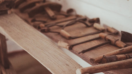 Ancient wooden tools used in traditional craftsmanship and rural life.の写真素材