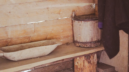 Old wooden bucket and tub for sauna use in vintage rural interior styleの写真素材