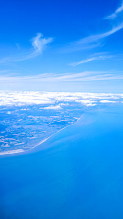 Aerial view of serene sky representing travel freedom and new experiencesの写真素材