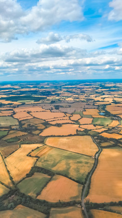 Aerial landscape with beautiful sky during high altitude flightの写真素材