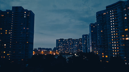 Twilight view of Kyiv apartment buildings in residential district of the city.