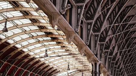 Vintage metal roof structure of old London train station, architectural background.の写真素材