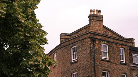 Classic British red brick architecture with vintage charm and detailed facadeの写真素材