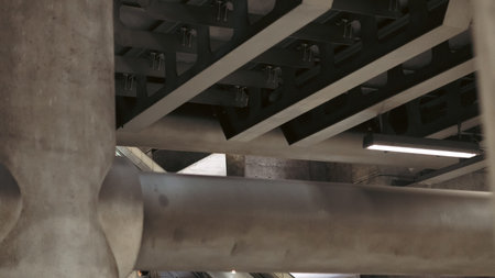 Steel pipes and metal frame under metro station escalator