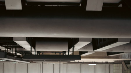 Steel pipes and metal frame under metro station escalator