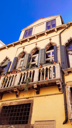 Ancient Venetian residential buildings with rustic faded walls.の写真素材