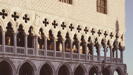 Golden morning light shining on St Mark's Square in peaceful Venice.の写真素材