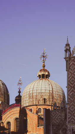 Golden morning light shining on St Mark's Square in peaceful Venice.