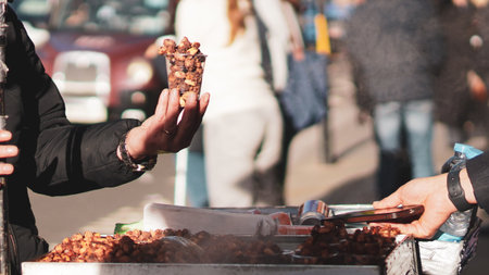 Sweet roasted peanuts at a festive London street market close up..の写真素材
