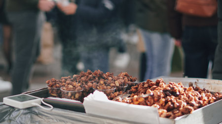 Sweet roasted peanuts at a festive London street market close up..の写真素材