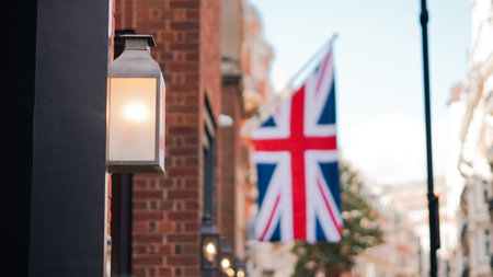 British flag above London street captured in urban street photo.