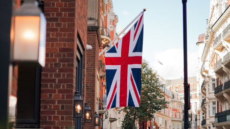 British flag above London street captured in urban street photo.の写真素材