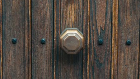 Old wooden door closeup showing rustic charm and antique craftsmanshipの写真素材