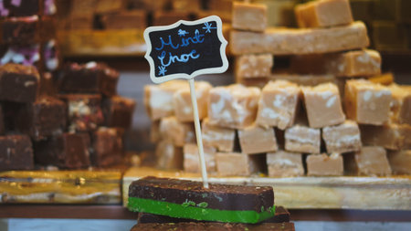 Traditional handmade candies and cookies shining on Christmas market sweet stall.の写真素材