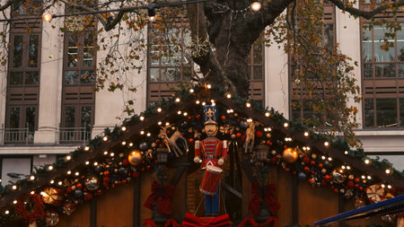 Close up of glowing Christmas market decoration with festive warm lights atmosphere.