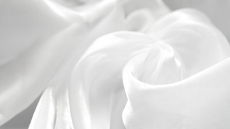 White tulle textile background with soft folds creating gentle minimal aesthetic.の写真素材