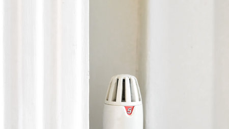White heater against neutral wall showing efficient home temperature control concept