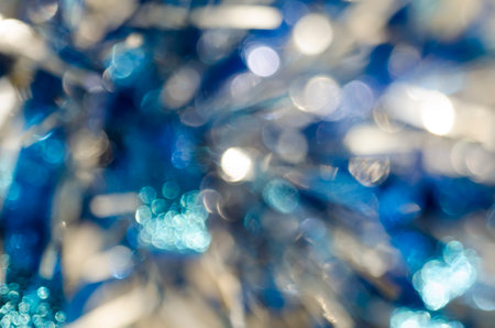 Festive shiny background with tinsel bokehの写真素材