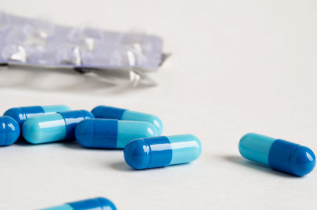 blue tablets lie on a white surface