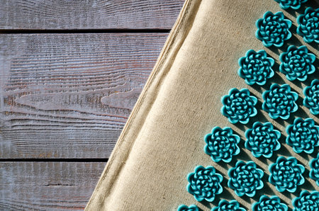 Massage mat on a wooden background. close-upの写真素材